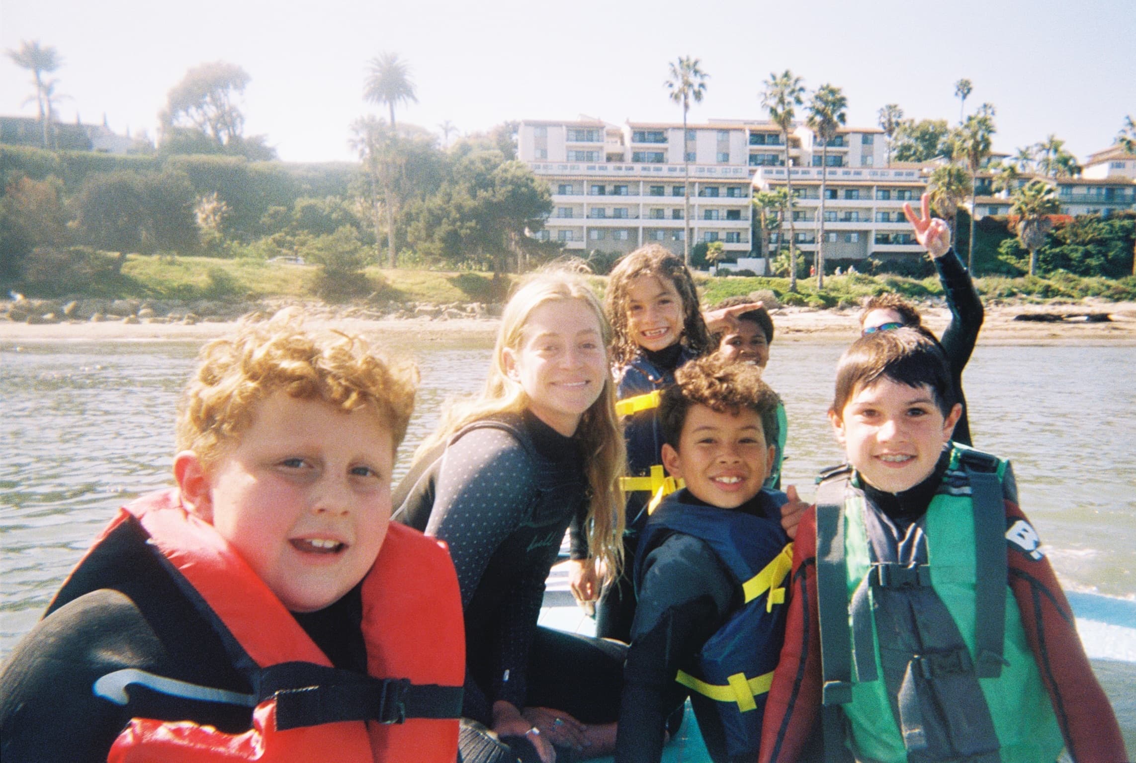 A young swimmer learning water confidence with a Big Blue Bridge coach