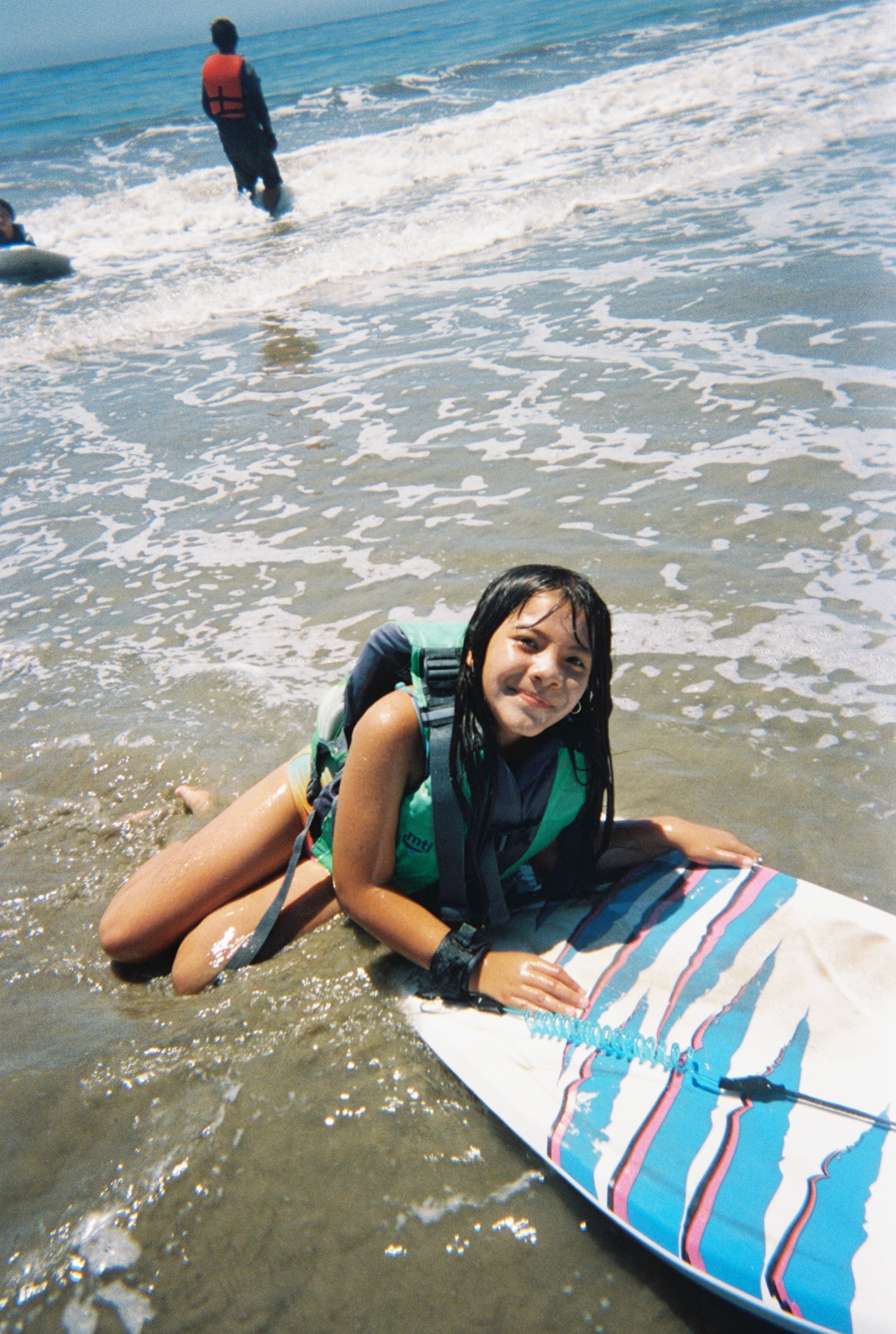 An anxious beginner gaining confidence in the water