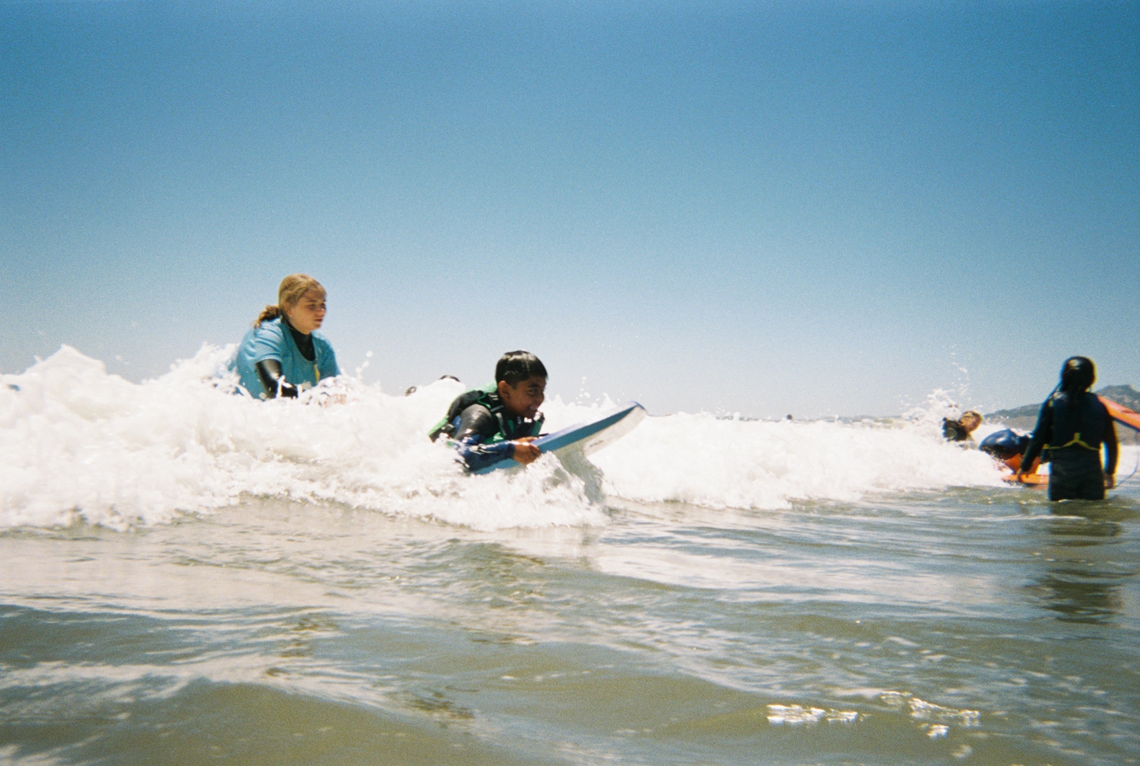 A kid learning to swim through a Sea League scholarship
